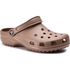 Klapki CROCS - Classic 10001 Bronze. Pomarańczowe klapki damskie Crocs, bez wzorów, z tworzywa sztucznego, bez obcasa. W wyprzedaży za 139,00 zł.