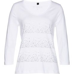 Shirt z połyskującymi kamieniami bonprix biało-srebrny. Białe koszulki damskie marki bonprix, bez wzorów, bez kołnierzyka, bez rękawów. Za 89,99 zł.