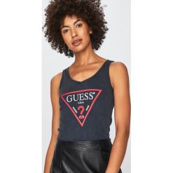 Guess Jeans - Top. Żółte bluzki damskie Guess Jeans, s, z aplikacjami, z bawełny, z okrągłym kołnierzem. Za 189,90 zł.