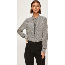 Tommy Hilfiger - Koszula. Białe bluzki damskie TOMMY HILFIGER, na co dzień, bez wzorów, z wiskozy, eleganckie, z klasycznym kołnierzykiem, z długim rękawem. W wyprzedaży za 269,90 zł.