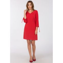 Tuniki damskie: Elegancka tunika z troczkami