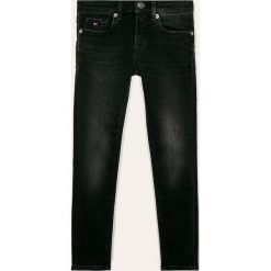 Tommy Hilfiger - Jeansy dziecięce Nora 128-176 cm. Czarne jeansy dziewczęce TOMMY HILFIGER, l, z aplikacjami, z elastanu. Za 299,90 zł.