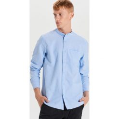 Gładka koszula o kroju slim - Niebieski. Niebieskie koszule męskie Cropp, s, bez wzorów, bez kołnierzyka, bez rękawów. Za 79,99 zł.