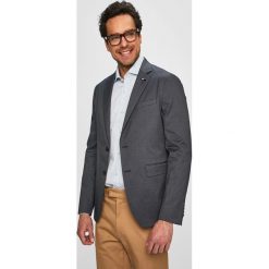 Tommy Hilfiger Tailored - Marynarka. Niebieskie garnitury męskie Tommy Hilfiger Tailored, bez wzorów, z elastanu, eleganckie. W wyprzedaży za 579,90 zł.