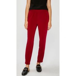 Answear - Spodnie Falling In Autumn. Brązowe spodnie damskie ANSWEAR, s, bez wzorów, z elastanu. W wyprzedaży za 49,90 zł.