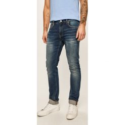 Calvin Klein Jeans - Jeansy CKJ 026. Niebieskie jeansy męskie Calvin Klein Jeans, z aplikacjami. Za 549,90 zł.