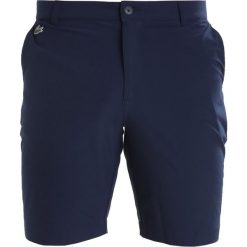 Lacoste Sport Krótkie spodenki sportowe marine. Niebieskie spodenki sportowe męskie Lacoste Sport, z elastanu, marine. W wyprzedaży za 375,20 zł.