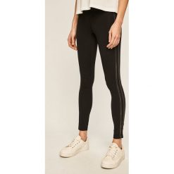 New Balance - Legginsy. Czarne spodnie damskie New Balance, s, z elastanu. W wyprzedaży za 129,90 zł.