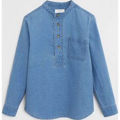 Mango Kids - Koszula dziecięca Pol 110-164 cm. Niebieskie koszule chłopięce Mango Kids, bez wzorów, z bawełny, casualowe, ze stójką, z długim rękawem, długie. Za 79,90 zł.