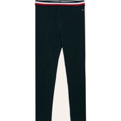 Tommy Hilfiger - Legginsy dziecięce 104-176 cm. Niebieskie spodnie dziewczęce TOMMY HILFIGER, bez wzorów, z elastanu. Za 119,90 zł.