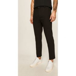 Calvin Klein - Spodnie. Czarne spodnie męskie Calvin Klein, bez wzorów, z elastanu. W wyprzedaży za 359,90 zł.