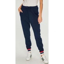 Reebok Classic - Spodnie. Niebieskie spodnie damskie Reebok Classic, s, bez wzorów, z elastanu, casualowe. W wyprzedaży za 189,90 zł.