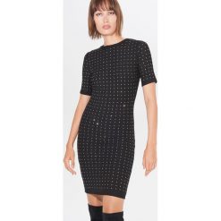 Sukienka bodycon z cekinami - Czarny. Czarne sukienki damskie Mohito, s, bez wzorów, bez kołnierzyka, bez rękawów, bodycon. Za 119,99 zł.