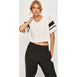 Reebok - T-shirt. Białe topy damskie Reebok, s, bez wzorów, z bawełny, z okrągłym kołnierzem. W wyprzedaży za 79,90 zł.