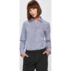 Tommy Hilfiger - Koszula. Białe bluzki damskie TOMMY HILFIGER, na co dzień, bez wzorów, z bawełny, klasyczne, z klasycznym kołnierzykiem, z długim rękawem. Za 399,90 zł.