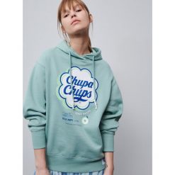 Bluza Chupa Chups - Turkusowy. Niebieskie bluzy damskie Reserved, s, bez wzorów, bez rękawów, bez kaptura. Za 119,99 zł.