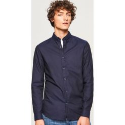 Koszula z bawełny oxford slim fit - Granatowy. Niebieskie koszule męskie Reserved, s, bez wzorów, z bawełny, bez kołnierzyka, bez rękawów. Za 99,99 zł.