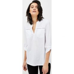 Bluzka z ażurowymi wstawkami. Bluzki damskie Moodo, xl, bez wzorów, bez kołnierzyka, bez rękawów. Za 44,99 zł.