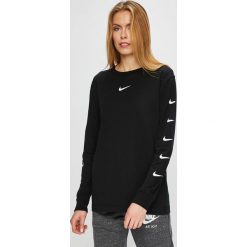 Nike Sportswear - Bluzka. Czarne bluzki nietoperze Nike Sportswear, l, z nadrukiem, z bawełny, casualowe, z okrągłym kołnierzem. Za 159,90 zł.