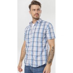 Niebieska Koszula Aglaomeine. Niebieskie koszule męskie Born2be, xl, bez wzorów, bez kołnierzyka, bez rękawów. W wyprzedaży za 34,99 zł.