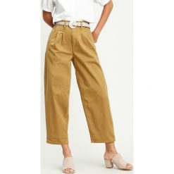 Levi's Spodnie Żółty Brązowy. Żółte spodnie damskie Levi's®, s, z elastanu. Za 430,95 zł.