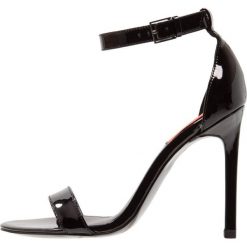 Calvin Klein Jeans PROSPER Sandały na obcasie black. Czarne sandały damskie Calvin Klein Jeans, z jeansu, na obcasie. Za 609,00 zł.