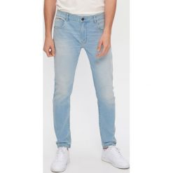 Jeansy skinny z bawełny z recyklingu - Niebieski. Niebieskie jeansy męskie House, bez wzorów. W wyprzedaży za 59,99 zł.