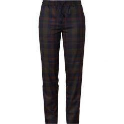 Holzweiler OLINE Spodnie materiałowe brown. Pomarańczowe spodnie damskie marki Holzweiler, s, z elastanu. Za 919,00 zł.