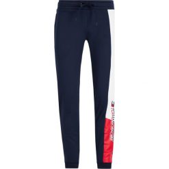 Spodnie dresowe Tommy Sport Graphic Flag S20S200205. Niebieskie jeansy męskie Tommy Sport, s, bez wzorów, z jeansu, sportowe. W wyprzedaży za 259,00 zł.