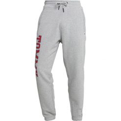 Tommy Jeans ESSENTIAL COLLEGE Spodnie treningowe grey. Szare spodnie dresowe męskie Tommy Jeans, z bawełny. Za 349,00 zł.