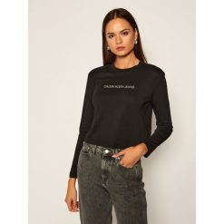 Bluzka Calvin Klein Jeans J20J214992. Białe bluzki damskie Calvin Klein Jeans, s, bez wzorów, z jeansu, bez kołnierzyka, bez rękawów. Za 179,00 zł.