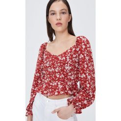 Kwiatowa bluzka z dekoltem - Pomarańczowy. Pomarańczowe bluzki damskie Sinsay, xl, bez wzorów, bez kołnierzyka, bez rękawów. W wyprzedaży za 19,99 zł.