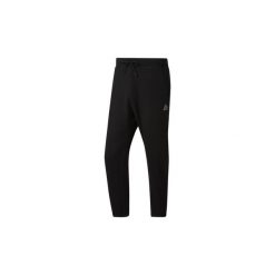 Spodnie treningowe Reebok Sport Spodnie dresowe Training Essentials 7/8. Czarne spodnie męskie Reebok Sport, m, bez wzorów, z dresówki, sportowe. Za 114,50 zł.