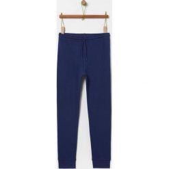 OVS - Spodnie dziecięce 146-170 cm. Niebieskie dresy chłopięce OVS, bez wzorów, z bawełny. Za 49,90 zł.