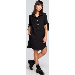 Sukienka koszulowa na guziki czarna. Czarne sukienki damskie e-margeritka.pl, na co dzień, s, bez wzorów, z poliesteru, eleganckie, z koszulowym kołnierzykiem, z długim rękawem, długie, midi, proste. Za 164,99 zł.