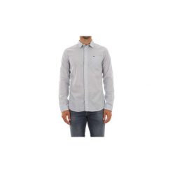 Koszule z długim rękawem Tommy Jeans DM0DM04481 TJM ESSENTIAL SOLID. Niebieskie koszule męskie Tommy Jeans, s, bez wzorów, z jeansu, bez kołnierzyka, z długim rękawem. Za 220,23 zł.