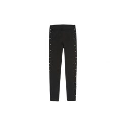 Spodnie damskie legginsy. Czarne legginsy marki TXM. Za 39,99 zł.