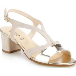 Buty damskie. Żółte klapki damskie Wittchen, w paski, ze skóry, na niskim obcasie, na słupku. W wyprzedaży za 319,90 zł.