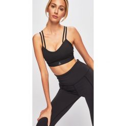 Reebok - Biustonosz sportowy. Czarne biustonosze sportowe damskie Reebok, s, bez wzorów, z elastanu. Za 119,90 zł.