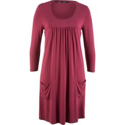 Sukienka shirtowa z rękawami 3/4 bonprix czerwony rododendron. Fioletowe sukienki z falbanami marki bonprix. Za 69,99 zł.