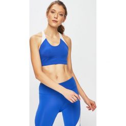 Reebok - Biustonosz. Niebieskie biustonosze sportowe damskie Reebok, xs, bez wzorów, z elastanu. W wyprzedaży za 69,90 zł.