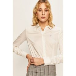 Guess Jeans - Koszula. Białe bluzki damskie Guess Jeans, na co dzień, s, z aplikacjami, z bawełny, eleganckie, z klasycznym kołnierzykiem, z długim rękawem. Za 279,90 zł.