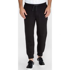 Armani Exchange Spodnie dresowe Czarny. Czarne spodnie męskie Armani Exchange, xl, bez wzorów, z elastanu. Za 571,95 zł.