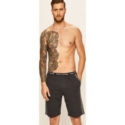 Tommy Hilfiger - Szorty piżamowe. Niebieskie piżamy męskie TOMMY HILFIGER, s, bez wzorów, z bawełny, bez rękawów. W wyprzedaży za 119,90 zł.