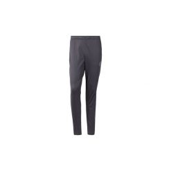 Spodnie treningowe Reebok Sport Spodnie Stacked Logo Trackster. Szare spodnie męskie Reebok Sport, s, bez wzorów, sportowe. Za 179,00 zł.