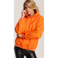 Pomarańczowa Bluza Xenyla. Pomarańczowe bluzy damskie Renee, s, bez wzorów, bez rękawów, bez kaptura. Za 89,99 zł.