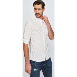 Tommy Jeans - Koszula. Niebieskie koszule męskie Tommy Jeans, s, bez wzorów, z bawełny, klasyczne, z klasycznym kołnierzykiem, z długim rękawem. W wyprzedaży za 219,90 zł.