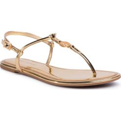 Sandały TORY BURCH - Emmy Flat Sandal 65178 Gold 701. Żółte klapki damskie Tory Burch, bez wzorów, ze skóry ekologicznej, bez obcasa. Za 889,00 zł.
