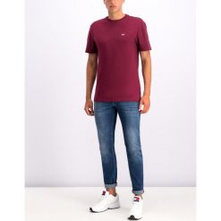 Jeansy Slim Fit Tommy Jeans DM0DM06610. Niebieskie spodnie męskie Tommy Jeans, m, bez wzorów, z elastanu. W wyprzedaży za 289,00 zł.