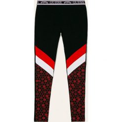 Guess Jeans - Legginsy dziecięce 113 - 157 cm. Czarne spodnie dziewczęce Guess Jeans, m, z aplikacjami, z elastanu. W wyprzedaży za 99,90 zł.